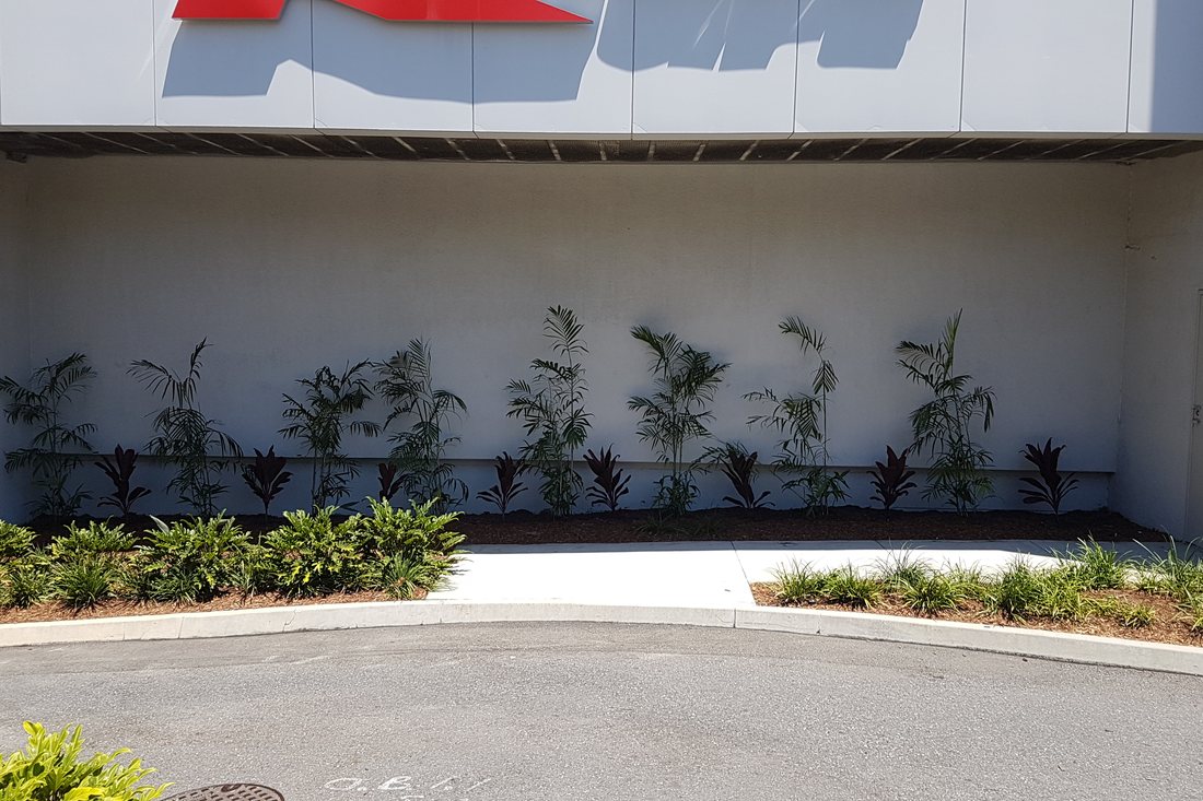 Pacific Fair — feature linear planter beneath a building canopy with bench seating